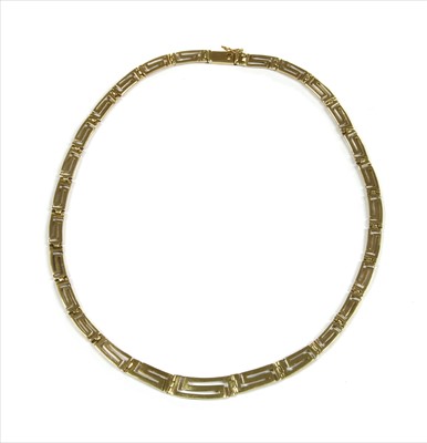 Lot 59 - A gold graduated Greek key design necklace