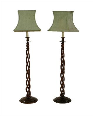 Lot 968 - A pair of tall beechwood open twist table lamps and shades