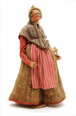 Lot 163 - A Jouglas carved wood figure of a traditional 19th century French lady