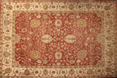 Lot 491 - A red ground persian rug