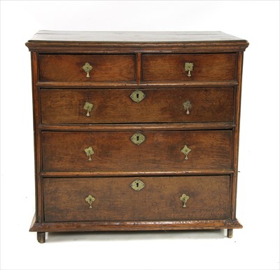 Lot 467 - A 17th century oak chest of five drawers