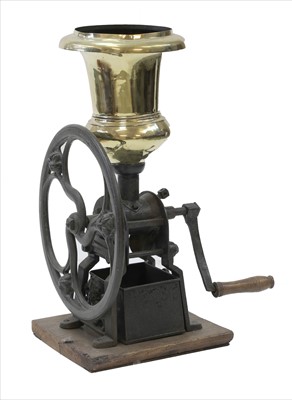 Lot 94 - A large cast iron and polished brass coffee grinder