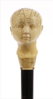 Lot 175 - A carved ivory phrenological head walking stick