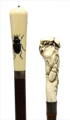 Lot 191 - Two carved ivory walking sticks