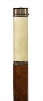 Lot 192 - An ivory and metal butt marker walking stick
