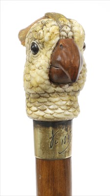 Lot 184 - A rare carved and painted ivory cockatoo automaton walking stick