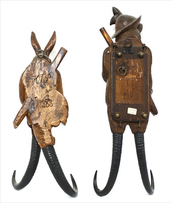 Lot 126 - Two Black Forest double wooden antler wall hooks