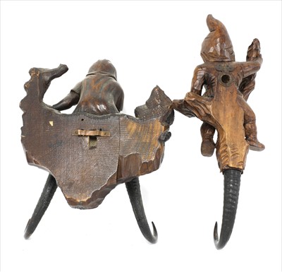 Lot 127 - Two Black Forest wooden wall hooks