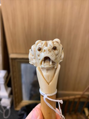 Lot 183 - A carved ivory triple bulldog's head walking stick