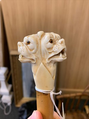 Lot 183 - A carved ivory triple bulldog's head walking stick