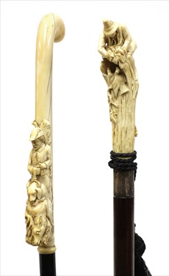 Lot 180 - Two German or Austrian carved ivory walking sticks