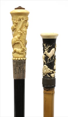 Lot 189A - Two carved antler walking sticks