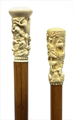 Lot 190 - Two carved ivory walking sticks