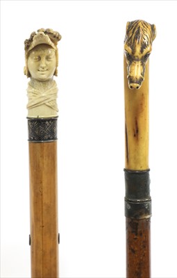 Lot 188 - Two carved antler walking sticks