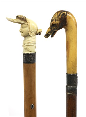 Lot 188 - Two carved antler walking sticks