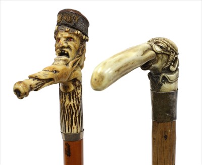 Lot 176 - Two carved antler walking sticks
