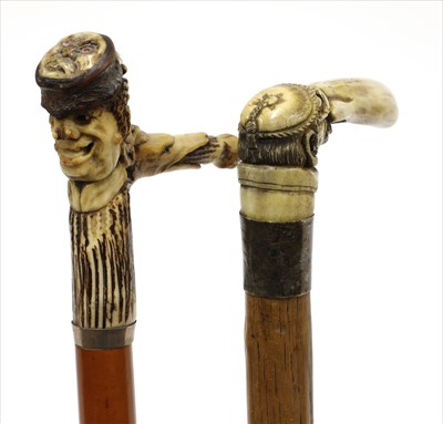Lot 176 - Two carved antler walking sticks