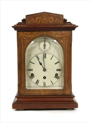 Lot 259 - An inlaid mahogany mantel clock