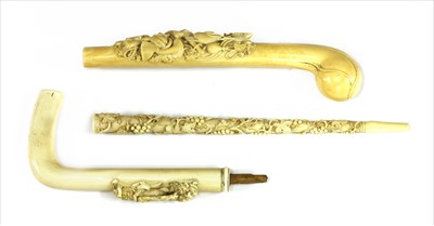 Lot 166 - Three carved ivory parasol or walking stick handles