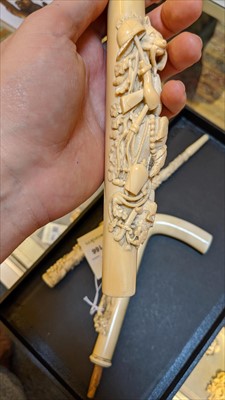 Lot 166 - Three carved ivory parasol or walking stick handles