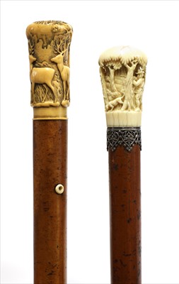 Lot 187 - A carved ivory-handled walking stick
