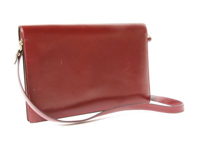 Lot 417 - An Hermès 'Lydie' red clutch bag