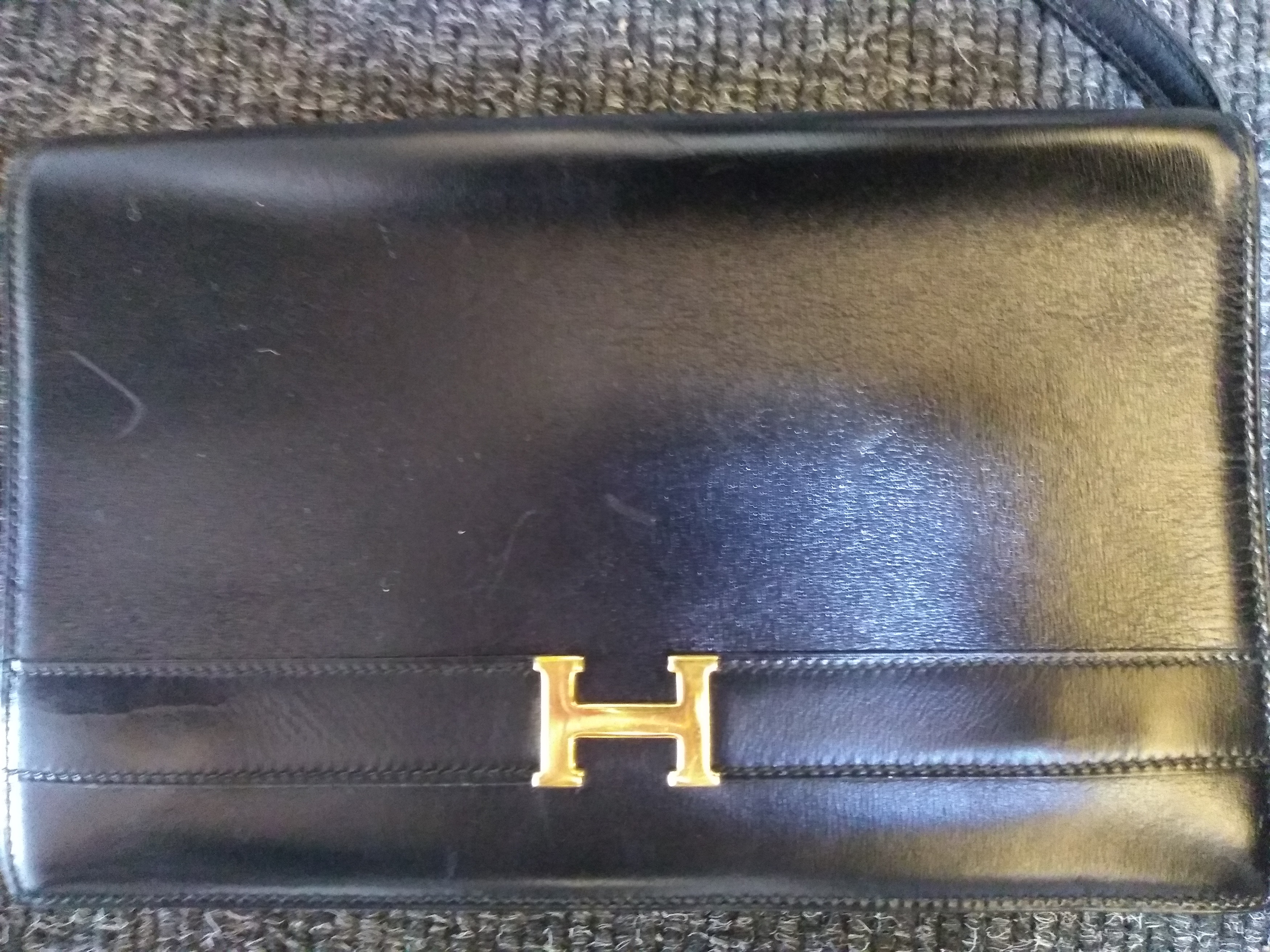 Lot 415 - An Hermès vintage black 'Annie' clutch bag