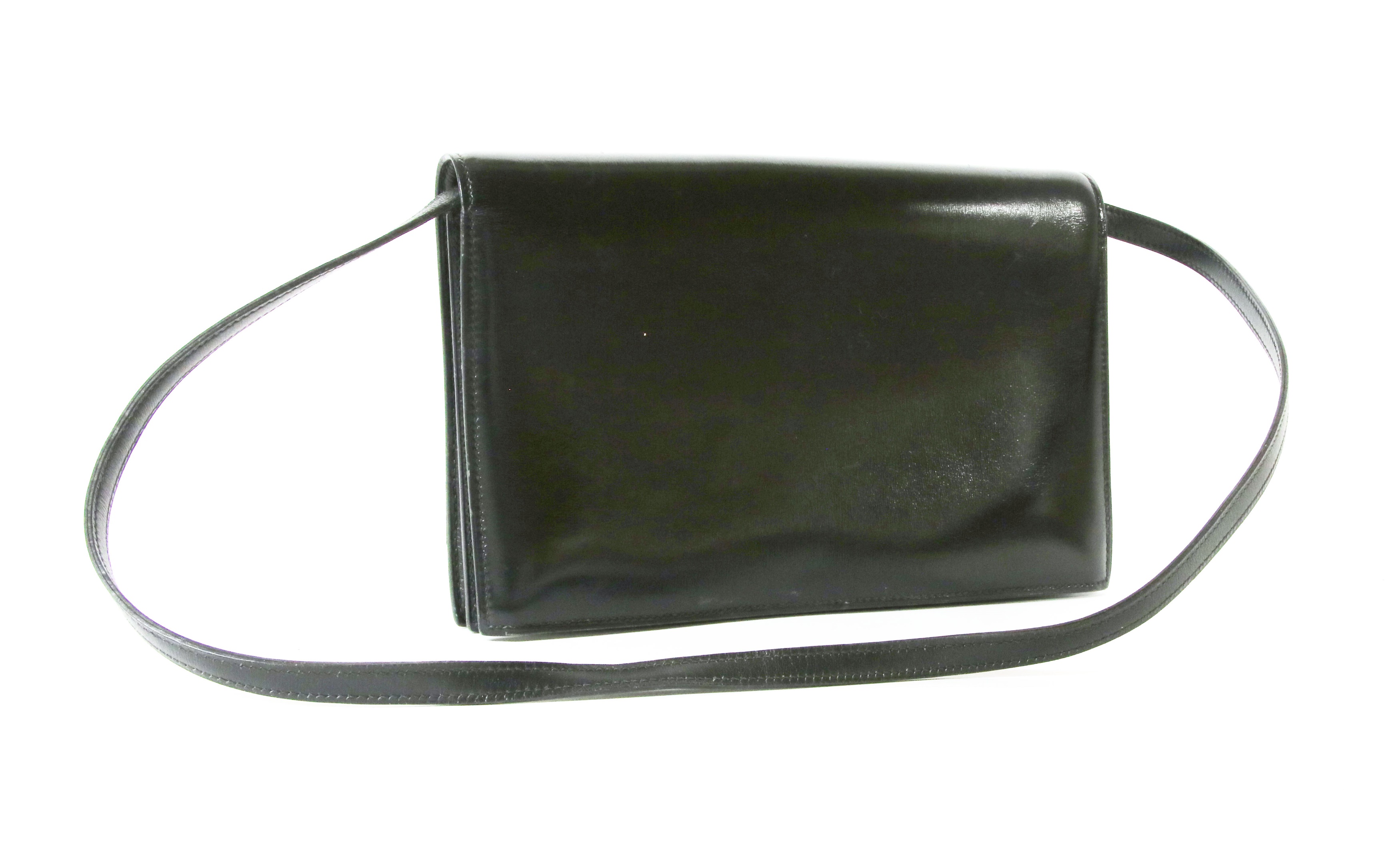 Lot 415 - An Hermès vintage black 'Annie' clutch bag