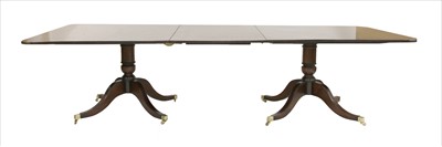 Lot 950 - A Georgian-style mahogany twin pillar dining table