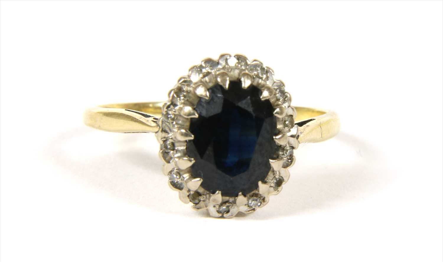 Lot 19 - A gold sapphire and diamond cluster ring
