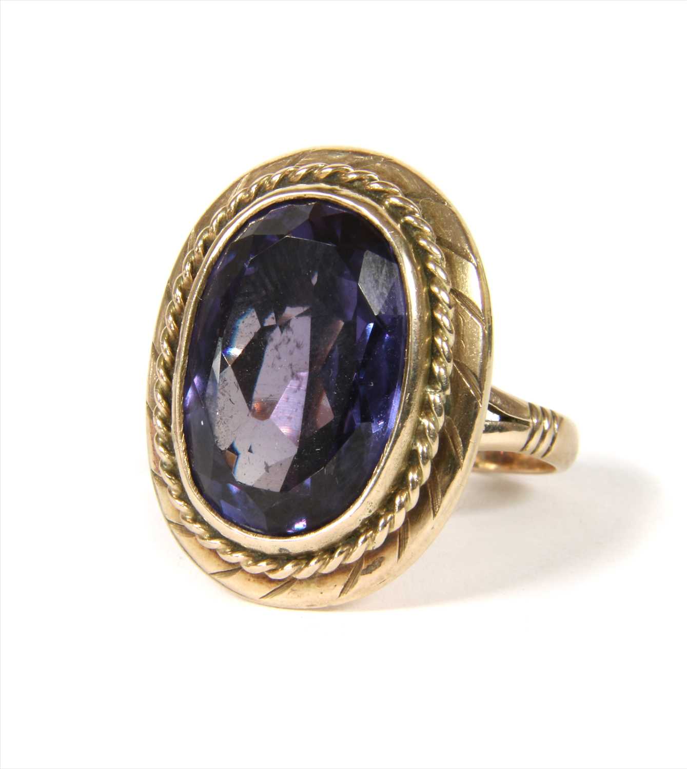 Lot 21 - A gold synthetic colour change sapphire ring
