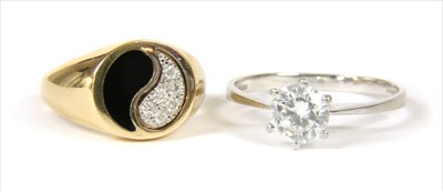 Lot 29 - A gold diamond and enamel yin and yang ring