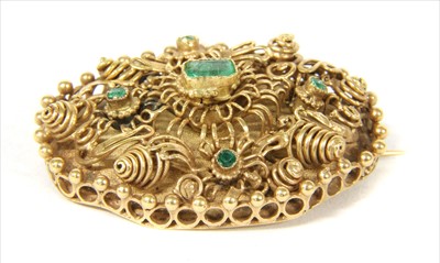 Lot 9 - A gold emerald oval cannetille brooch