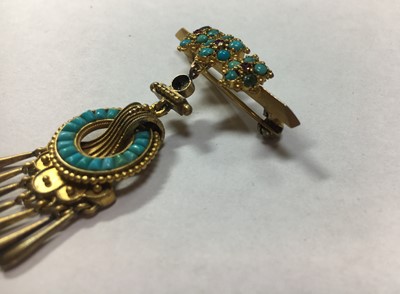 Lot 11 - A gold ruby and turquoise brooch