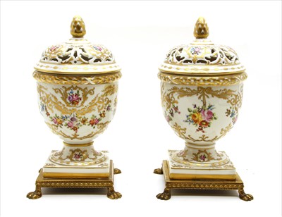 Lot 168 - A pair of early 20th century Continental pot pourri vases and covers