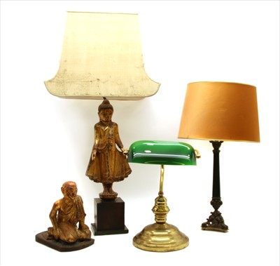 Lot 205 - A carved and gilt figural table lamp