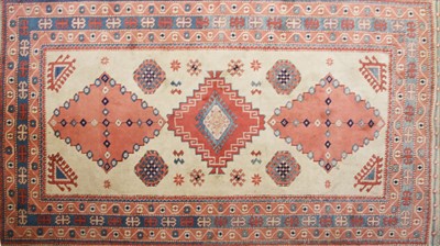 Lot 365 - A Caucasian ivory red ground rug