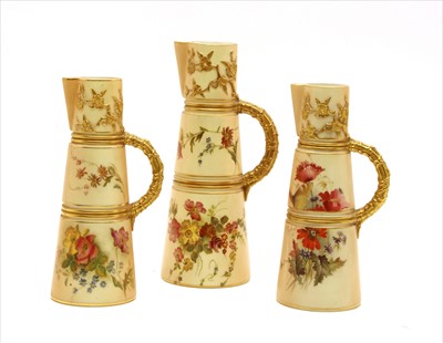 Lot 275 - A pair of Royal Worcester blush ivory jugs