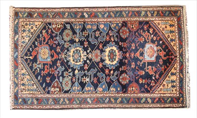 Lot 825 - A blue ground Caucasian carpet