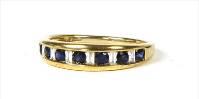 Lot 33 - A gold sapphire and diamond half eternity ring