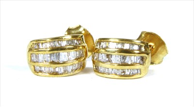 Lot 73 - A pair of silver gilt diamond stud earrings