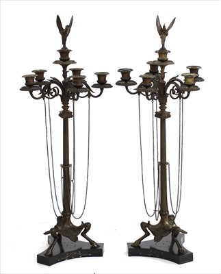 Lot 780 - A pair of French bronze candelabra