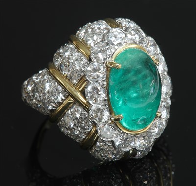 Lot 140 - An
emerald and diamond bombé form ring by David Webb