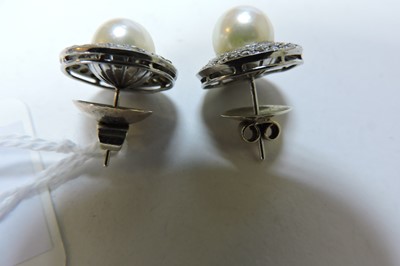 Lot 167 - A pair of cultured pearl and diamond cluster earrings, c.1950