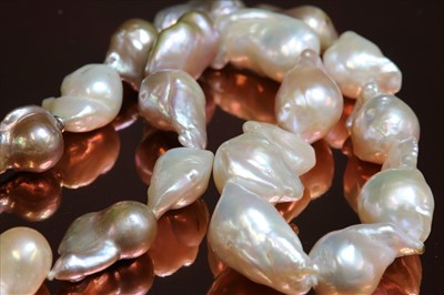 Lot 162 - A single row graduated baroque cultured pearl necklace