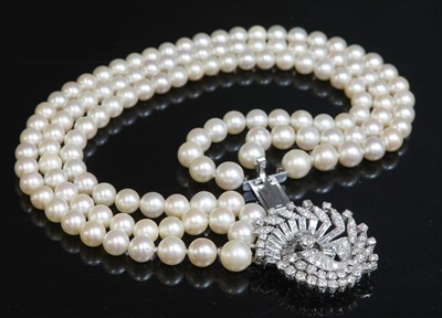 Lot 165 - A three row graduated cultured pearl necklace, c.1950