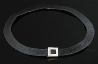 Lot 265 - A two colour gold 'Black Gold' and white gold diamond set collar by Yvel