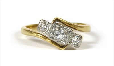 Lot 28 - A gold three stone diamond ring