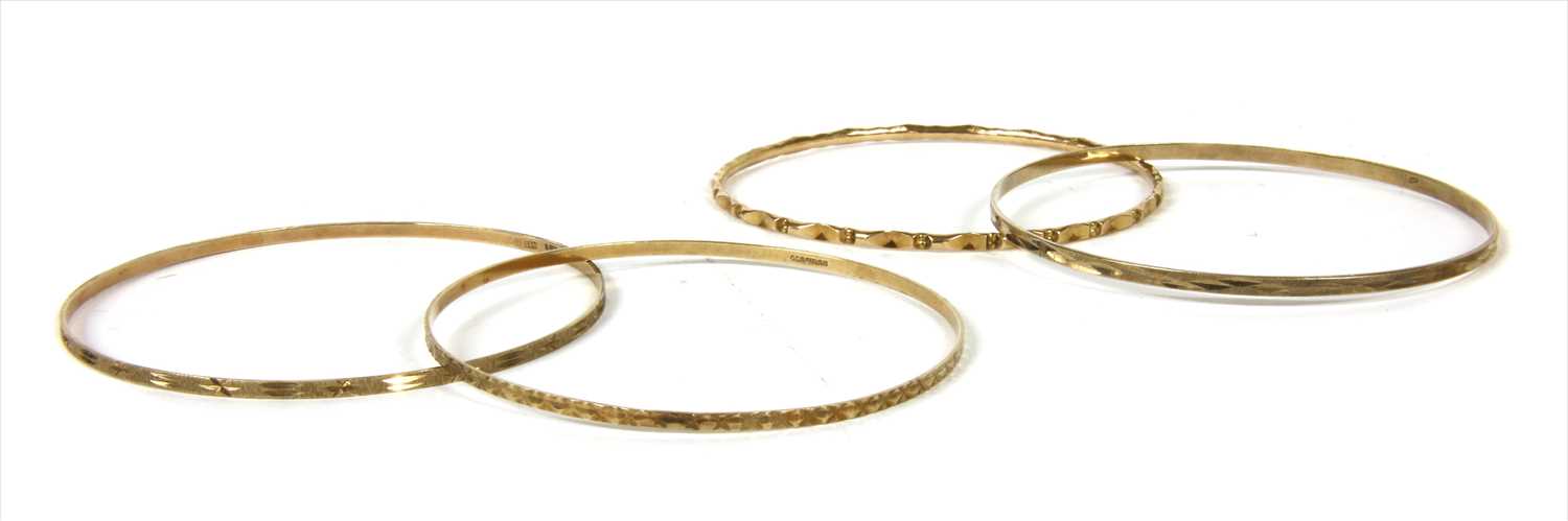 Lot 44 - Four 9ct gold bangles