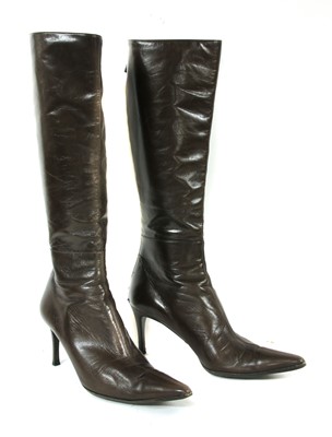 Lot 1055 - A pair of Gucci brown leather knee-high heeled boots